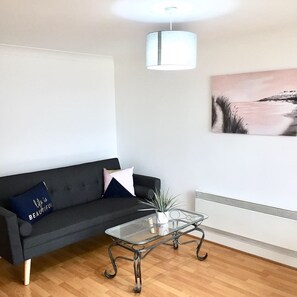 Basic Apartment, 2 Double Beds, City View | Living area | Flat-screen TV