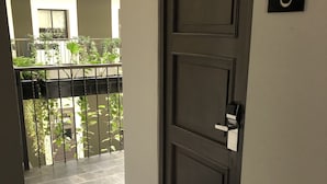A closed door with a number plate '106' on the wall.