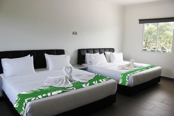 Hill View Family Quad Room | Blackout drapes, iron/ironing board, bed sheets