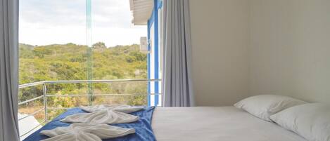 Deluxe Room, 1 King Bed, Pool View | Minibar, in-room safe, individually decorated, blackout drapes