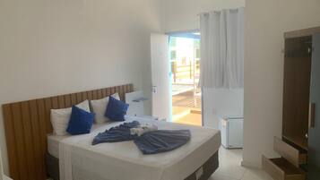 Deluxe Room, 1 King Bed, Pool View | Minibar, in-room safe, individually decorated, blackout curtains