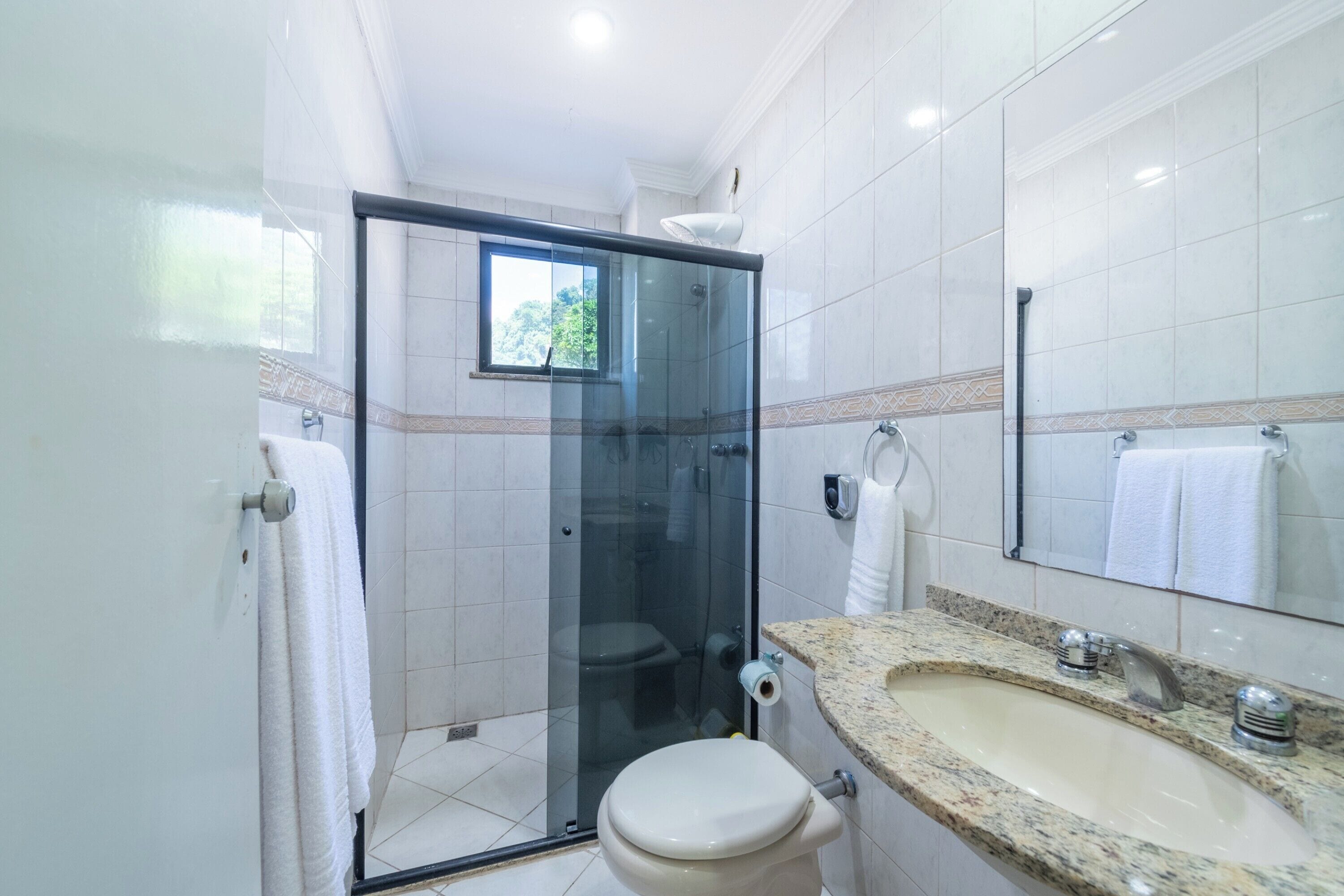 Shower, towels, soap, toilet paper