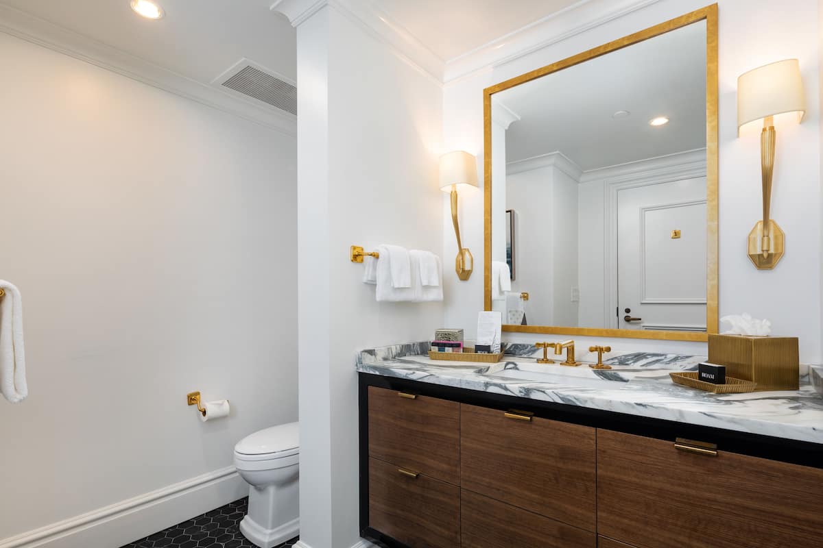 city suite, 1 king bed, city view | bathroom | shower, hair dryer, bathrobes, towels