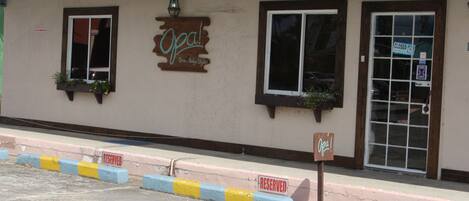 A building with a sign that reads "Opal Skin, Body, Style" and a "CLOSED" sign on the door.