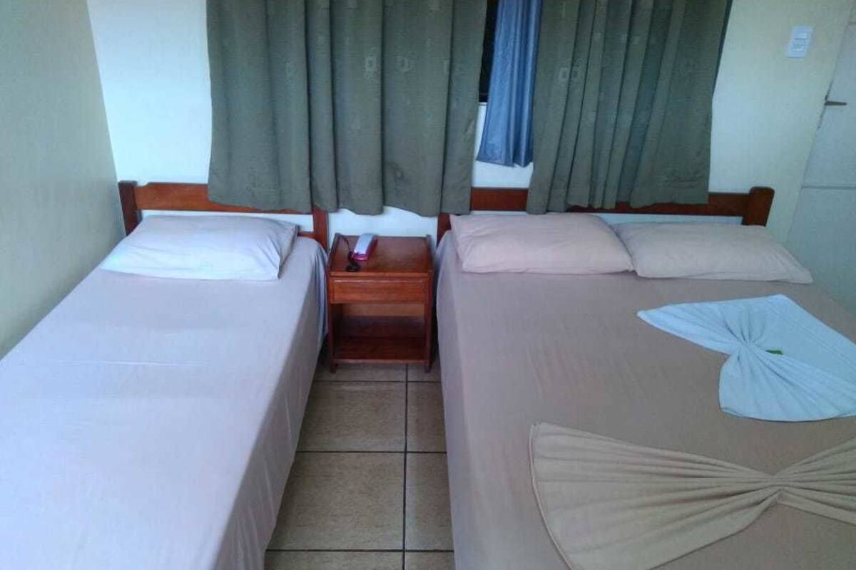 triple room, 3 single beds | desk, blackout curtains, iron/ironing board, free wifi