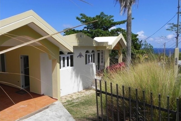 View of the Front of Surf View Villa with the Ocean in the Background