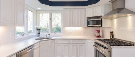 Fridge, coffee/tea maker, cookware/dishes/utensils
