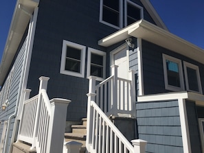 Stunning residential building with a classic staircase and double-hung windows.