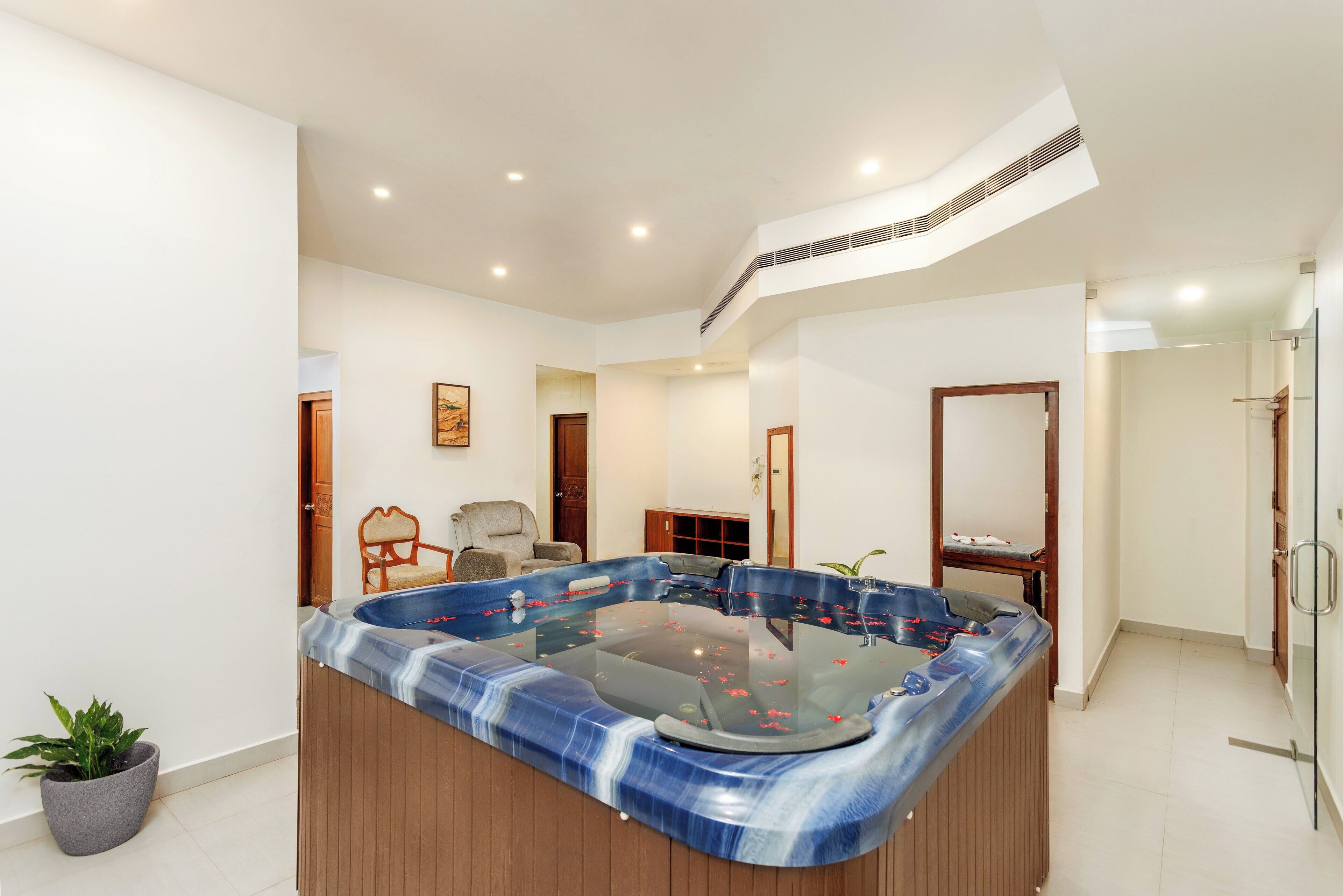 A modern bathroom with a freestanding bathtub, a shower area, and a toilet.
