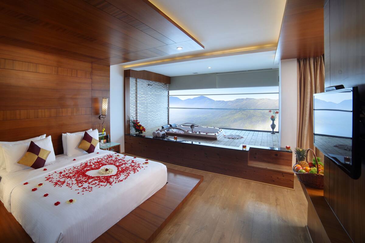 Madhura Honeymoon Suite with jacuzzi | Premium bedding, in-room safe, desk, laptop workspace