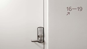 A hotel room door with a numeric keypad lock and a number '15' on the left side.