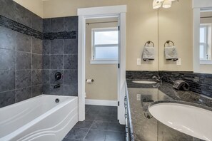 Combined shower/bathtub, hair dryer, towels, soap