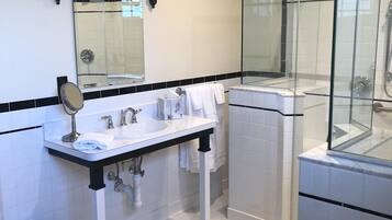 Combined shower/bathtub, hair dryer, towels, toilet paper