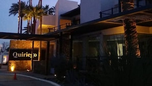 A modern building with a sign that reads "Quiriego." - Marsella 45 (Hermosillo)