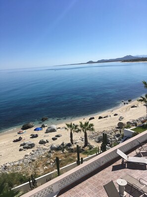 On the beach, sun loungers, beach towels