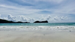 A beach with clear skies and calm waters. - Malakati Homestay (Nacula Island)
