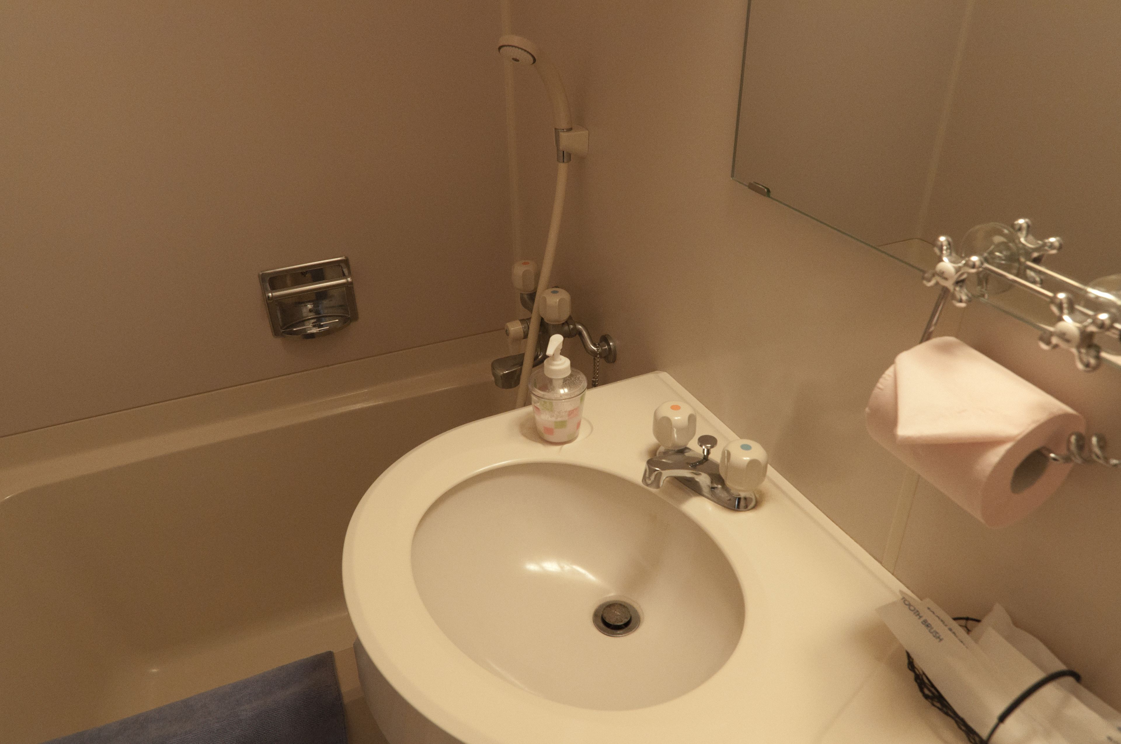 twin room | bathroom | free toiletries, hair dryer, slippers, towels