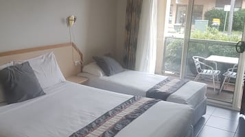 Twin Room | 1 bedroom, individually furnished, desk, blackout drapes