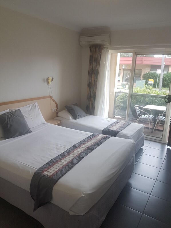 Twin Room | 1 bedroom, individually furnished, desk, blackout drapes