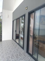 Family Villa, Kitchen, Beachfront | Terrace/patio