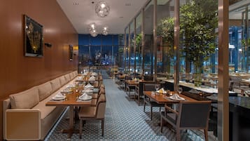 Enjoy meals with a city view from the central seating area.