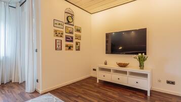 Apartment | Living area | 130-cm Smart TV with cable channels, TV