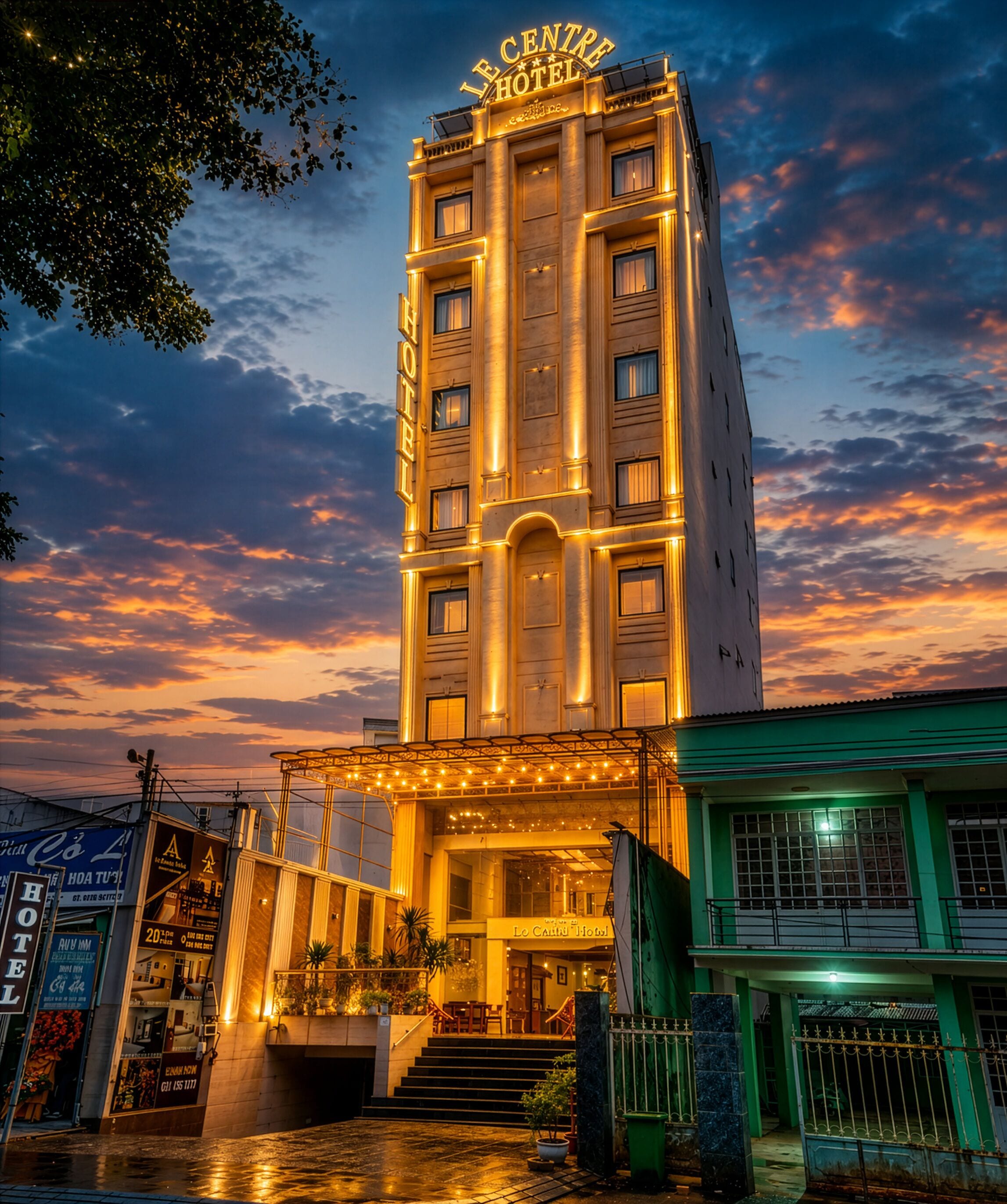 A hotel with a prominent sign, multiple floors, and a well-lit entrance.