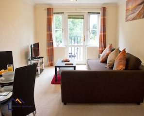 Apartment, 1 Bedroom, Garden View | Living area | Flat-screen TV