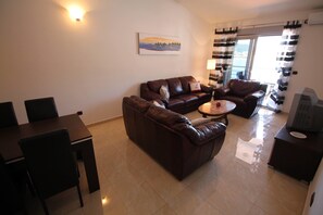 Comfort Penthouse, Multiple Beds, Sea View | Living area | LCD TV, DVD player - Sea Front Apartments (Becici)