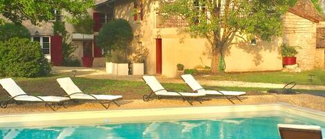Seasonal outdoor pool, open 8:00 AM to 10:00 PM, pool loungers