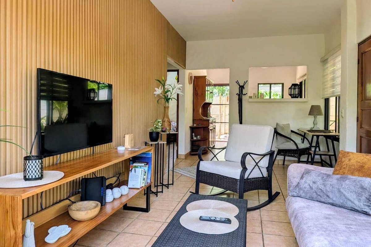 Standard Apartment | Living area | 30-inch LCD TV with cable channels, TV, Netflix