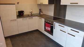 Deluxe Apartment, Multiple Beds, Courtyard View | Private kitchen | Fridge, oven, stovetop, espresso maker