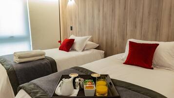 Premium bedding, down comforters, minibar, in-room safe