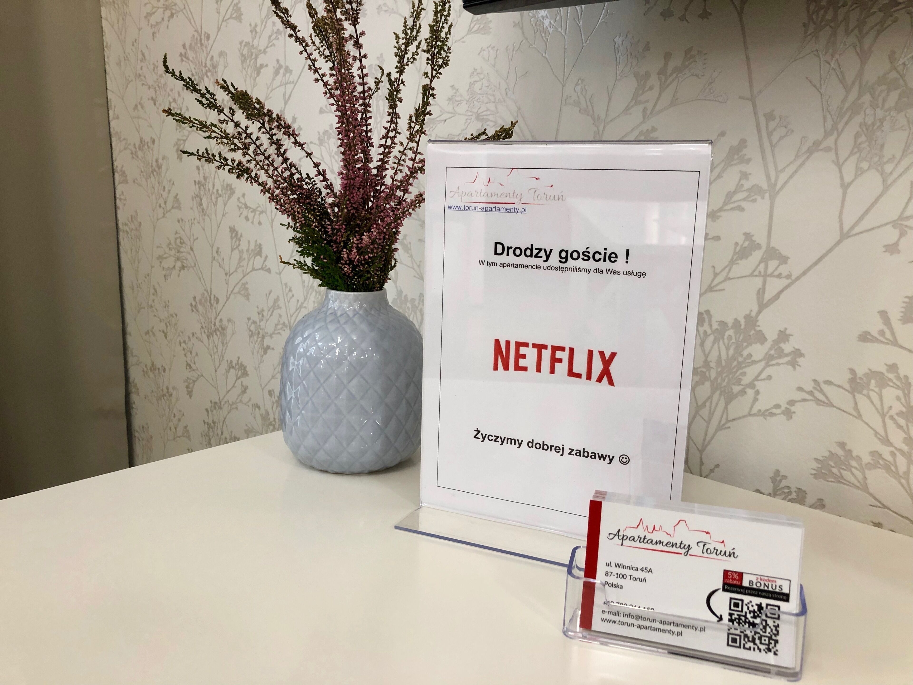 A sign offering free Netflix access in a room.