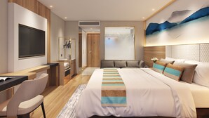 A modern hotel room with a bed, a desk, a chair, a TV, and a large window. - GreenTree Inn Chongqing Longhu Times Tianjie Xietaizi Subway Station Hotel (Chongqing)