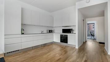 Apartment, 3 Bedrooms | Private kitchen | Full-size fridge, oven, stovetop, dishwasher