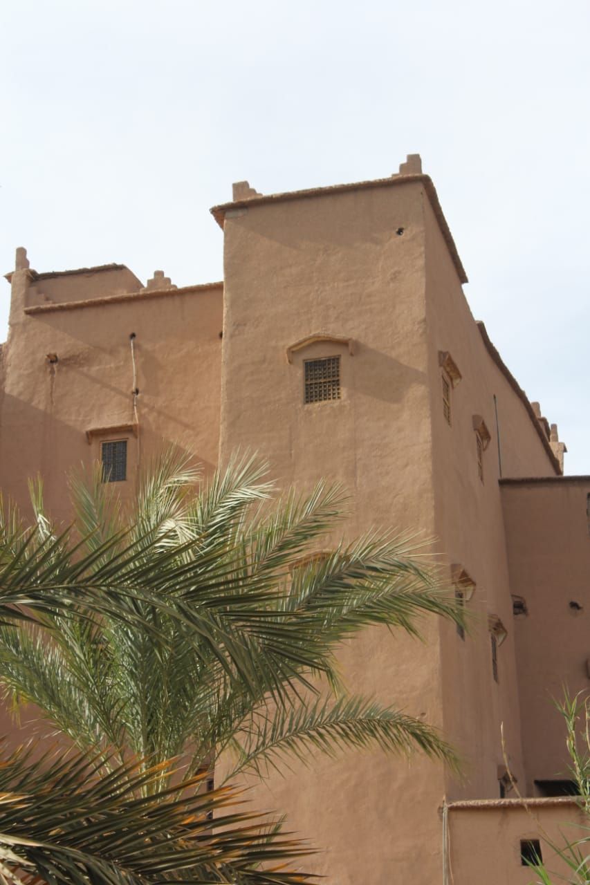 A building with a flat roof and a small window.