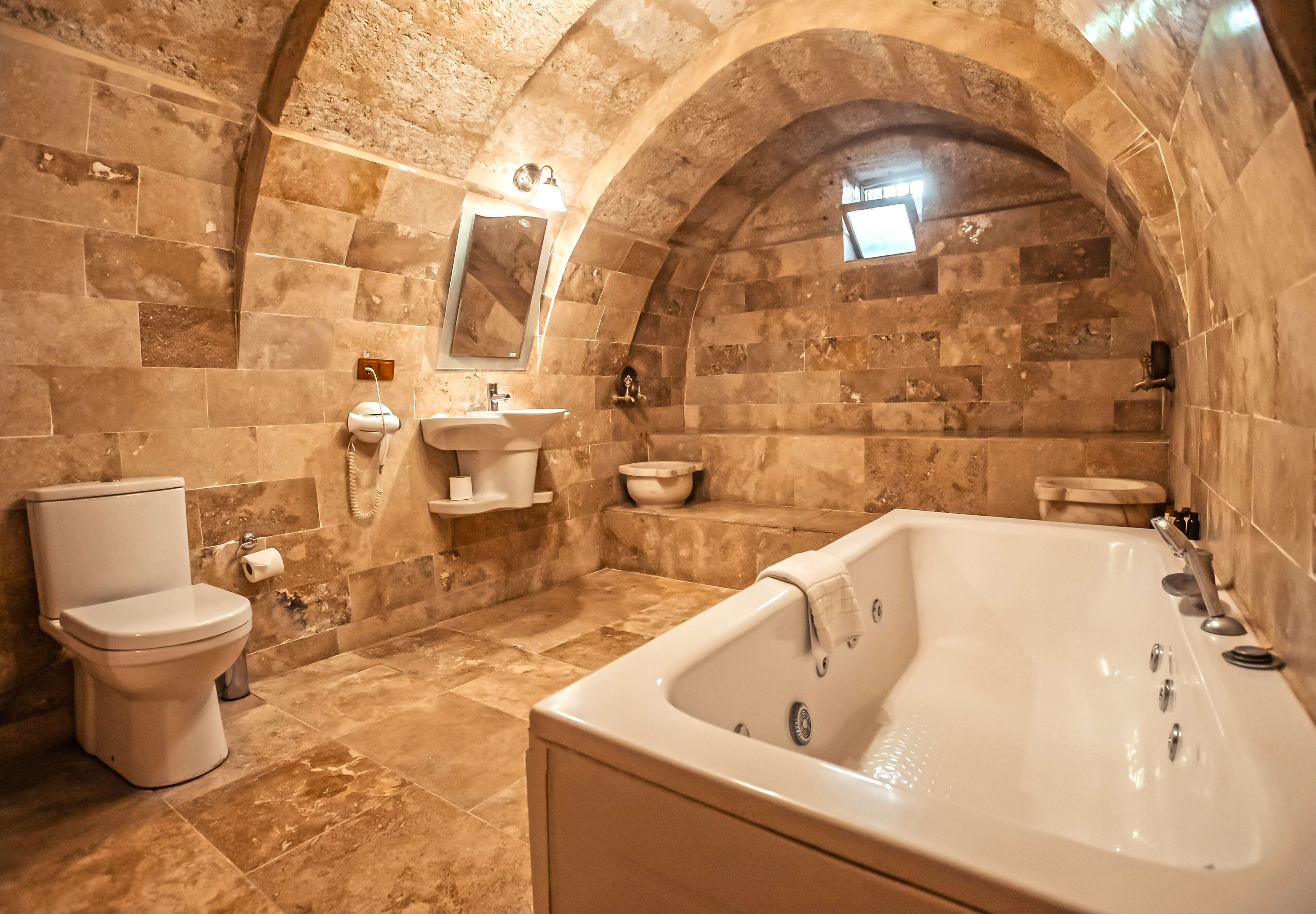 suite, jetted tub (stone) | bathroom | designer toiletries, hair dryer, slippers, towels