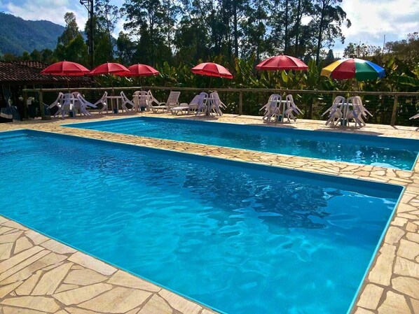 10 outdoor pools, pool umbrellas, sun loungers