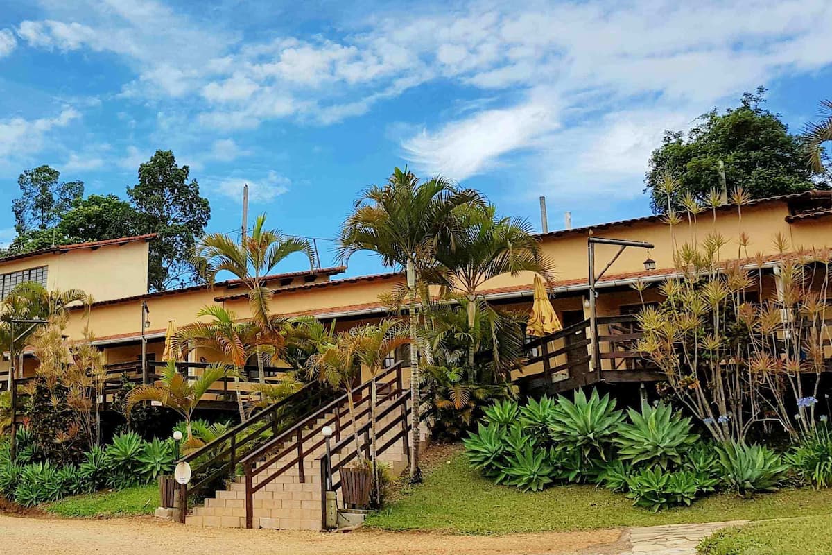 A two-story building with a staircase leading to the upper level.