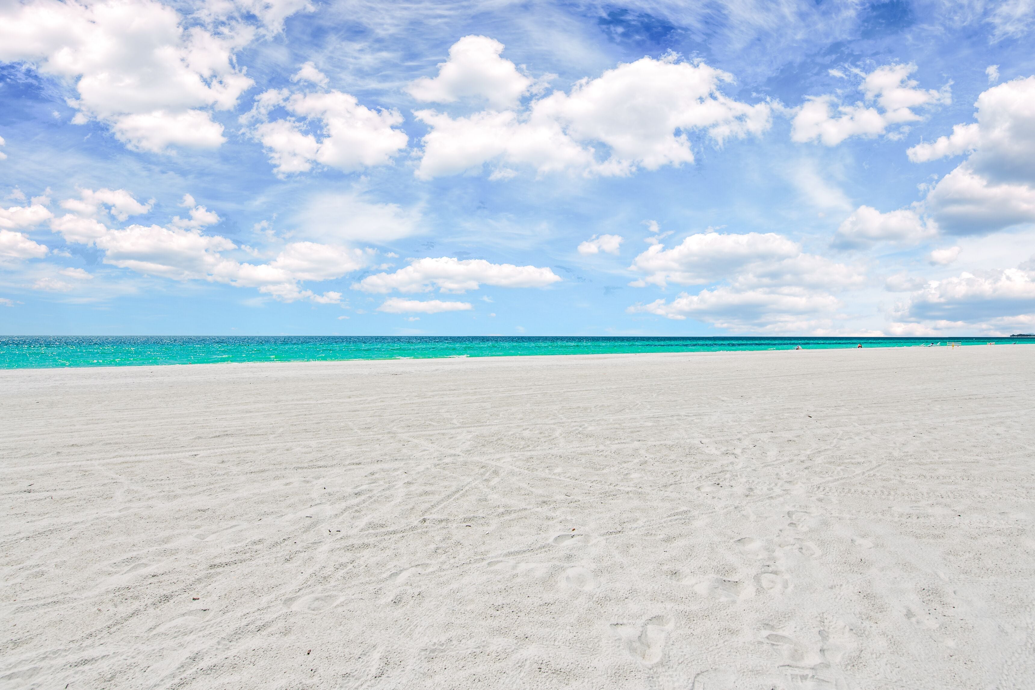 on the beach, white sand, sun-loungers, beach umbrellas