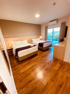 Standard Quadruple Room, 2 Queen Beds | Minibar, in-room safe, desk, blackout drapes - Legacy Hotel (Guaratingueta)