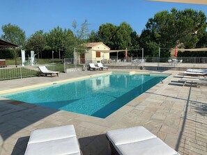Seasonal outdoor pool, open 9:00 AM to 7:00 PM, pool umbrellas