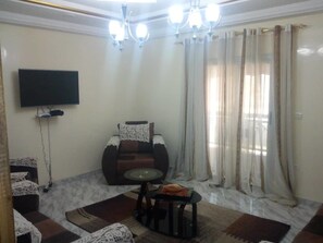 Apartment | Living area | Flat-screen TV - Residence Fatou Ndiaye (St. Louis)