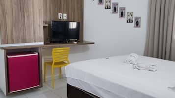 Minibar, desk, blackout curtains, iron/ironing board