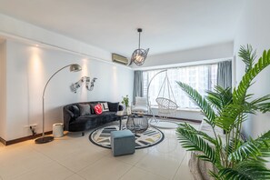 Apartment, 3 Bedrooms | Living room | Flat-screen TV