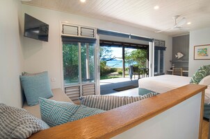 Deluxe Studio Suite, 1 King Bed, Beach View | Individually decorated, individually furnished, desk, free WiFi