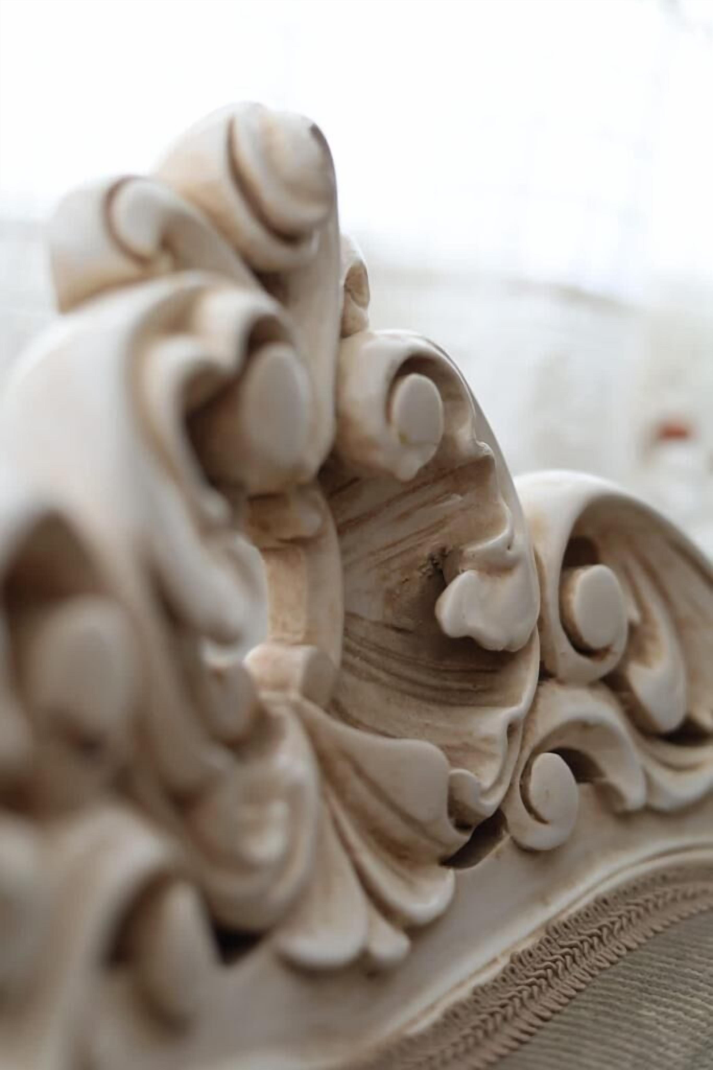 A close-up of a carved architectural detail, likely part of a building's facade or interior design.