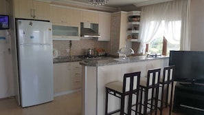 Deluxe Apartment, 2 Bedrooms, Balcony, Lake View (Manolya) | Private kitchen | Stovetop