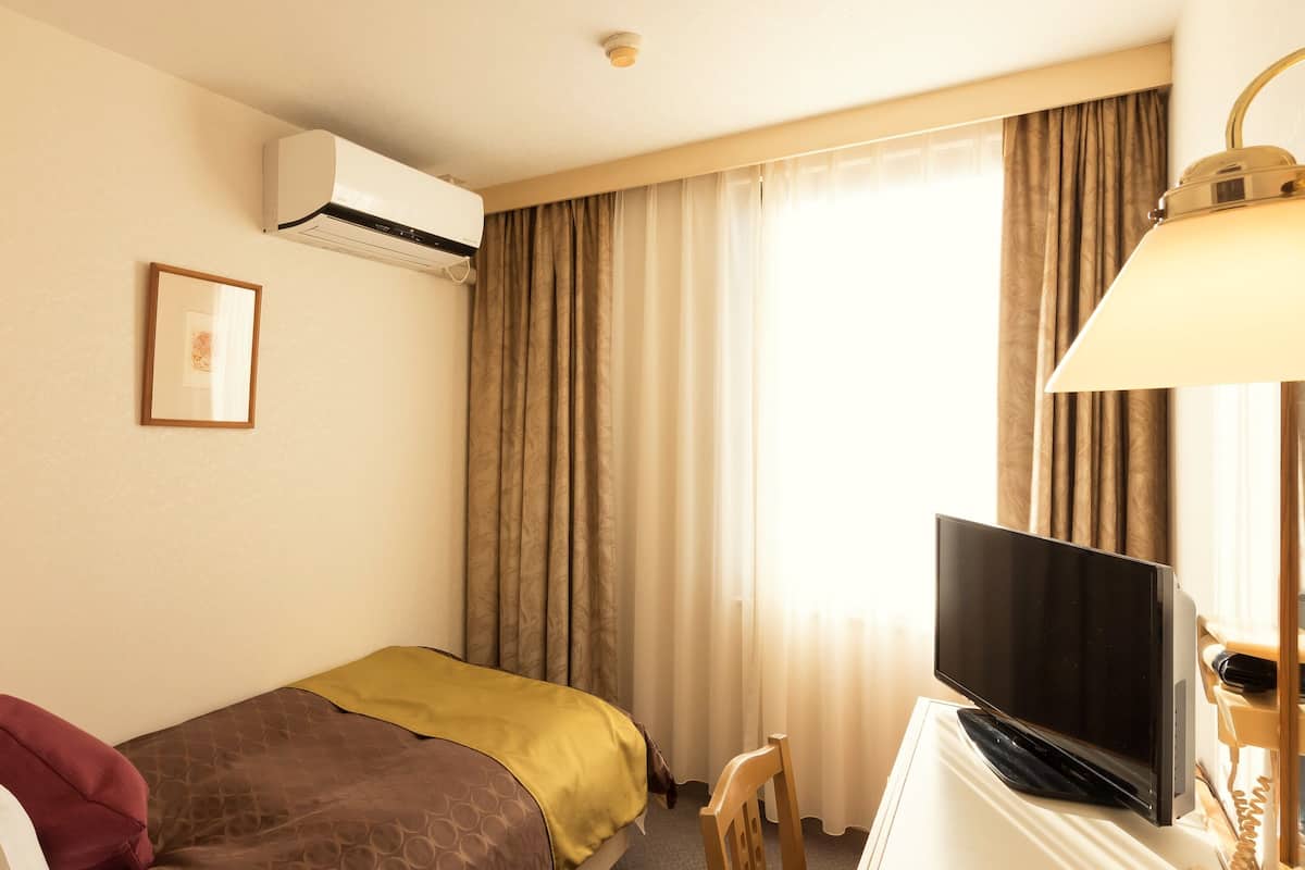 Desk, blackout curtains, iron/ironing board (on request), free WiFi